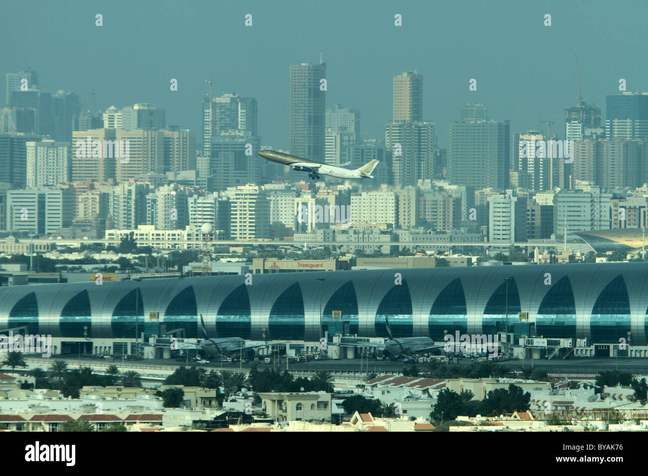 A plane takes off from Dubai's new International Airport terminal Stock Photo