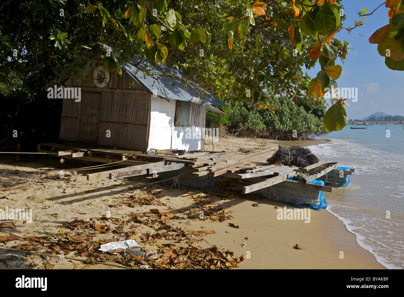 A Thai fish farm house on the beach in Chalong bay, Phuket Stock Photo Alamy