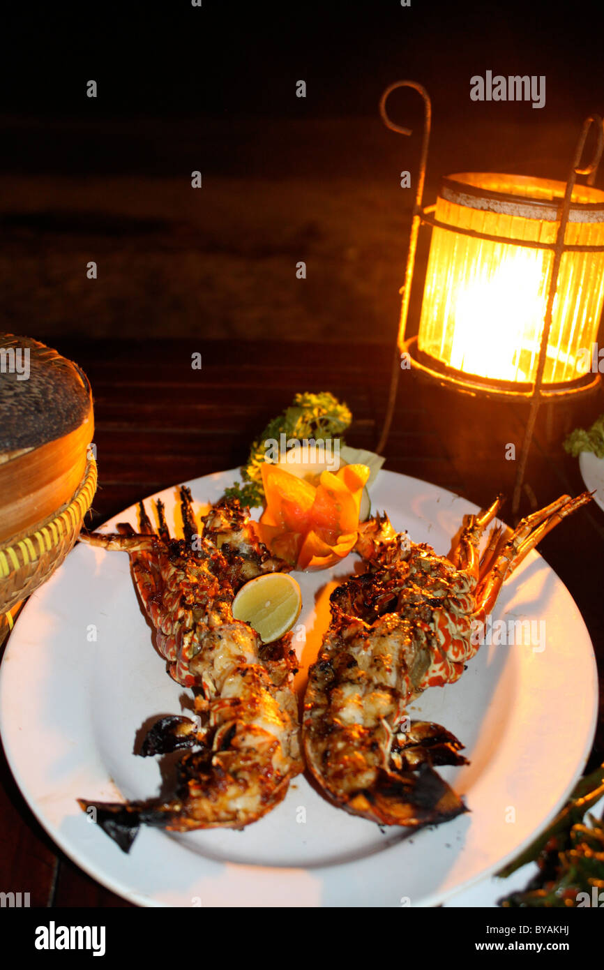 Lobster dinner by candlelight at a seafood restaurant Jimbaran bay, Bali Stock Photo Alamy