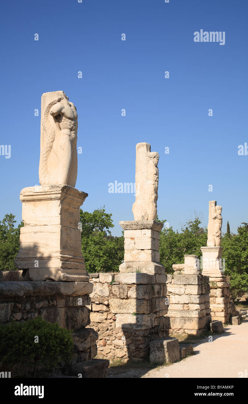 Statues of Serpent tailed Giant and Tritons in front of the Odeon of