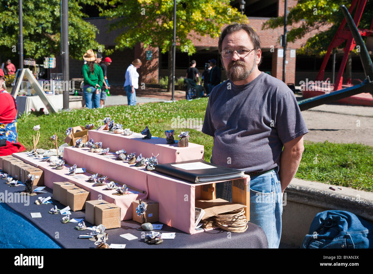 Local craftsman near the cruise terminal selling hand crafted souvenirs made from shells in Portland, Maine Stock Photo