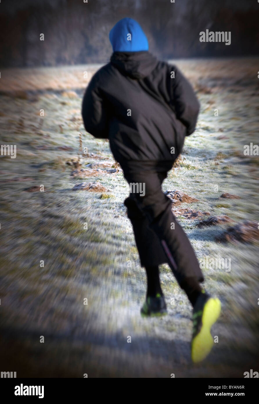 man in hoody running Stock Photo