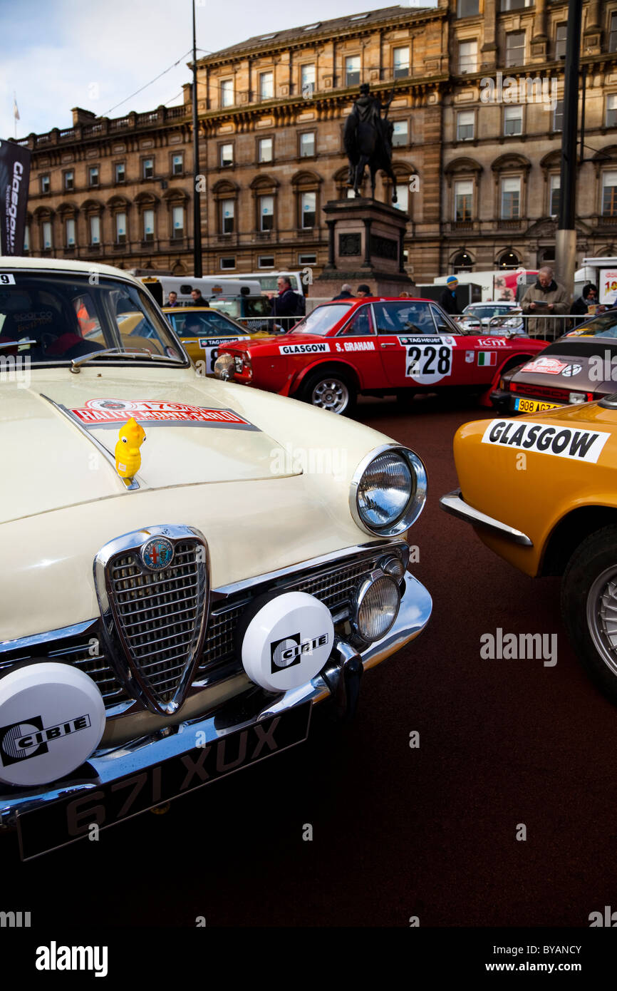 Rally cars parked in George Square Glasgow at the start of the 100th Rallye Monte Carlo. White car is an Alfa Romeo Guilietta TI Stock Photo