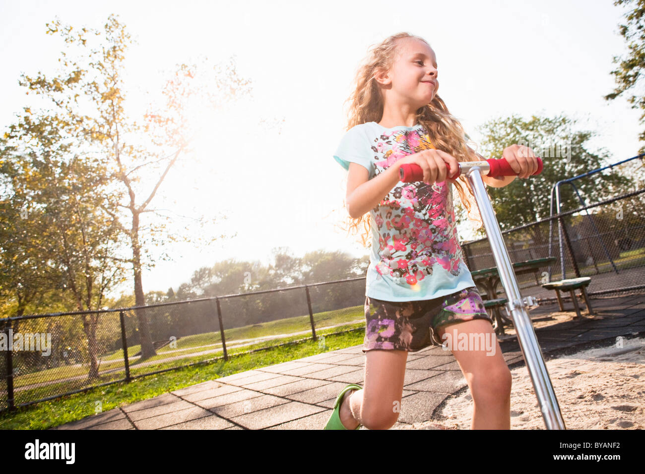 Girl on scooter Stock Photo Alamy