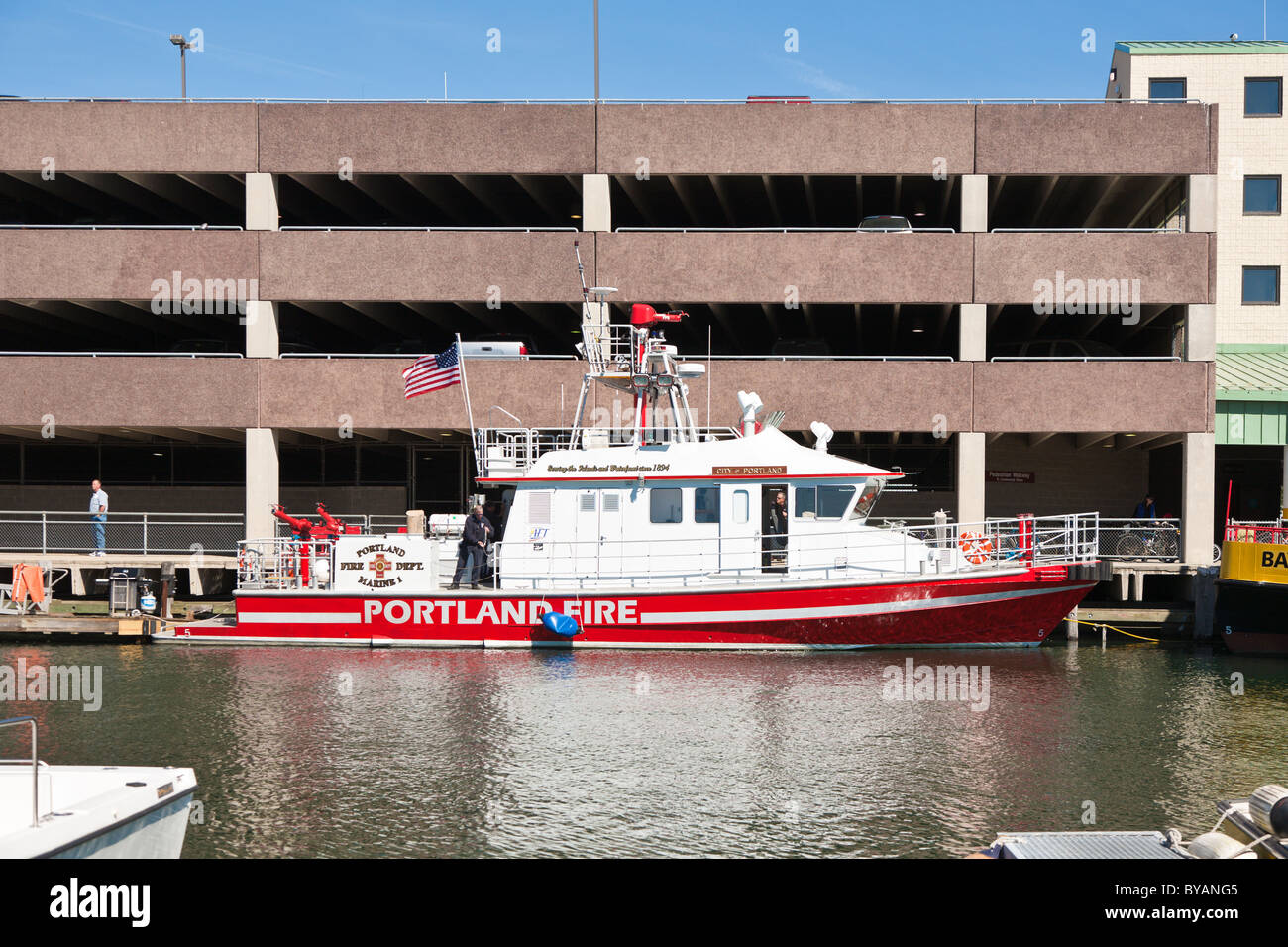 City of Portland, Maine Fire Department boat, Marine 1 docked in front of parking garage Stock Photo