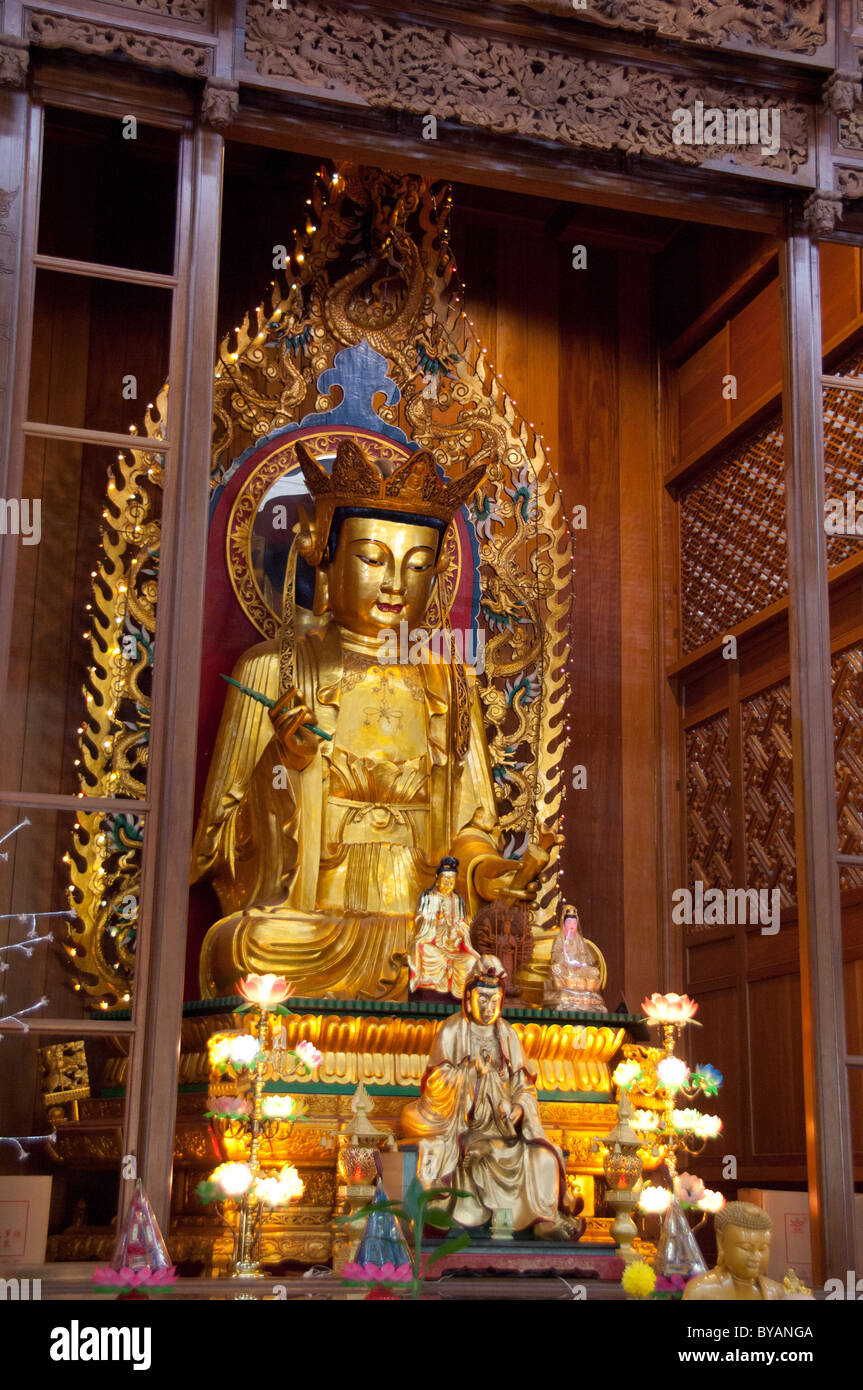 Malaysia, Island of Penang. Kek Lok Si Temple, largest temple in Southeast Asia. Golden Buddha shrine. Stock Photo