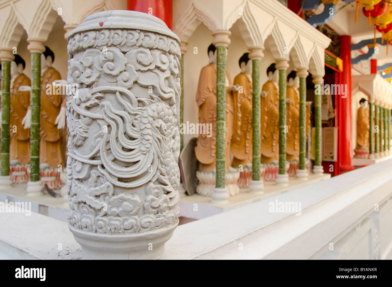Malaysia, Island of Penang. Kek Lok Si Temple, largest temple in Southeast Asia. Ornate carved column. Stock Photo