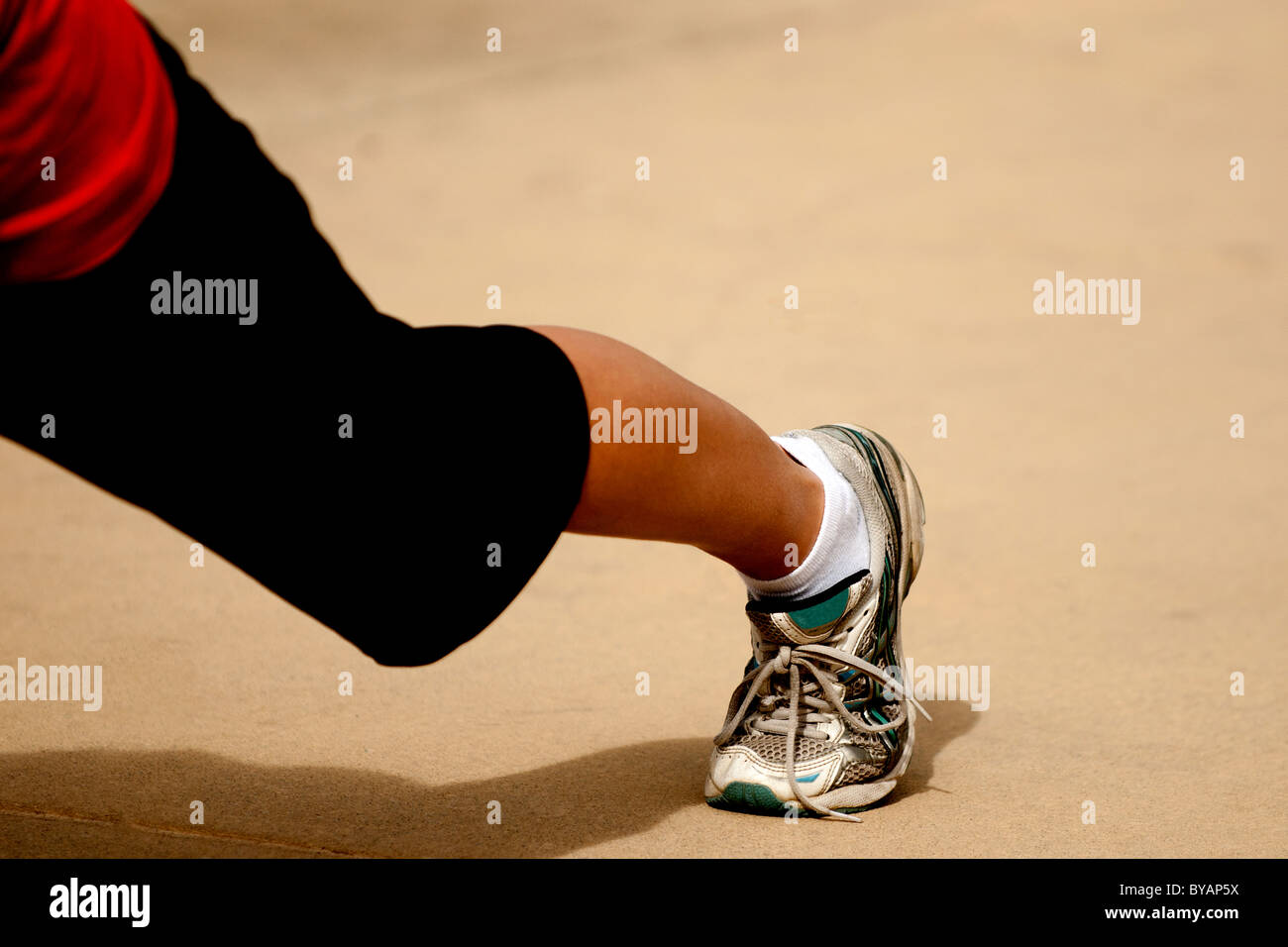 Outdoor spring training exercise in city park showing beautiful young blond Caucasian woman enjoying working out Stock Photo