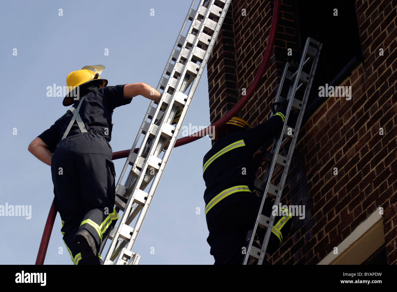 Fireman climbing a ladder hires stock photography and images Alamy