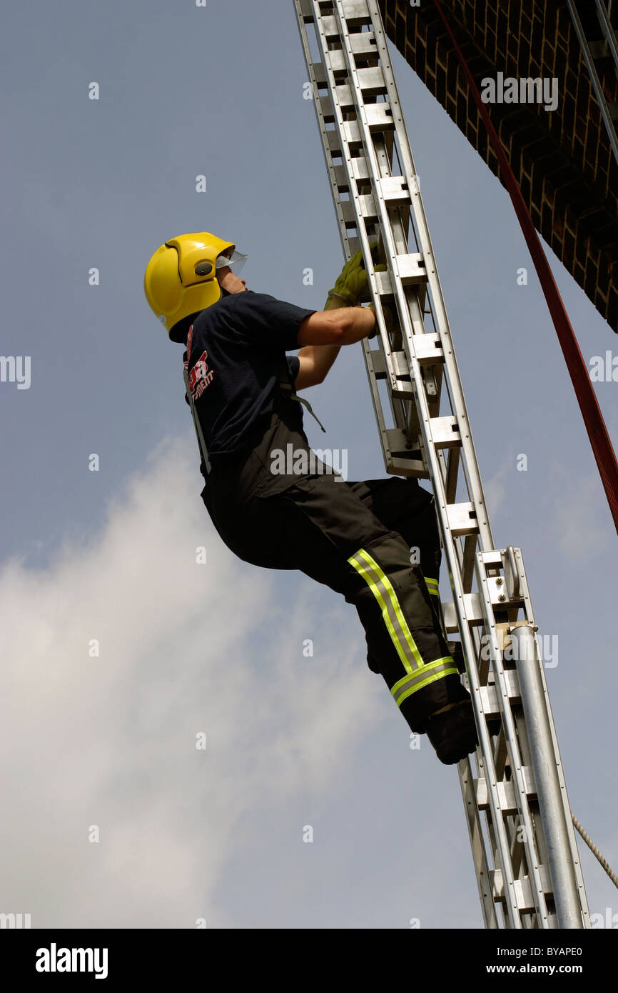 Fireman climbing a ladder hires stock photography and images Alamy
