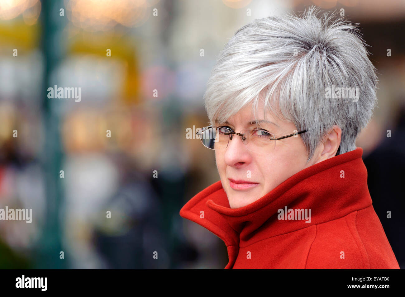 Mature woman looking around, portrait, over 50 Stock Photo