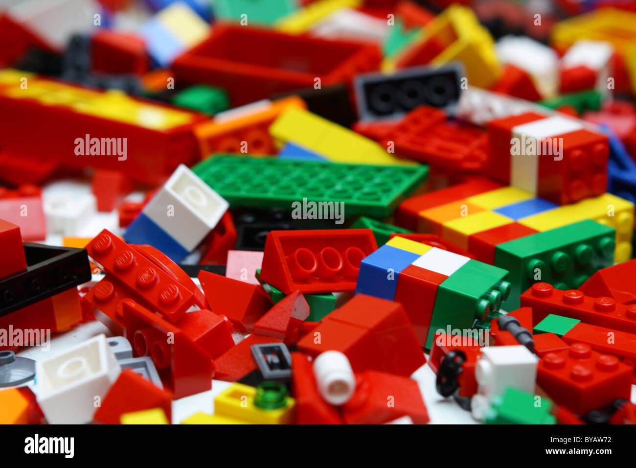 Lego pieces spread on and around floor dominant in the color red Stock  Photo - Alamy