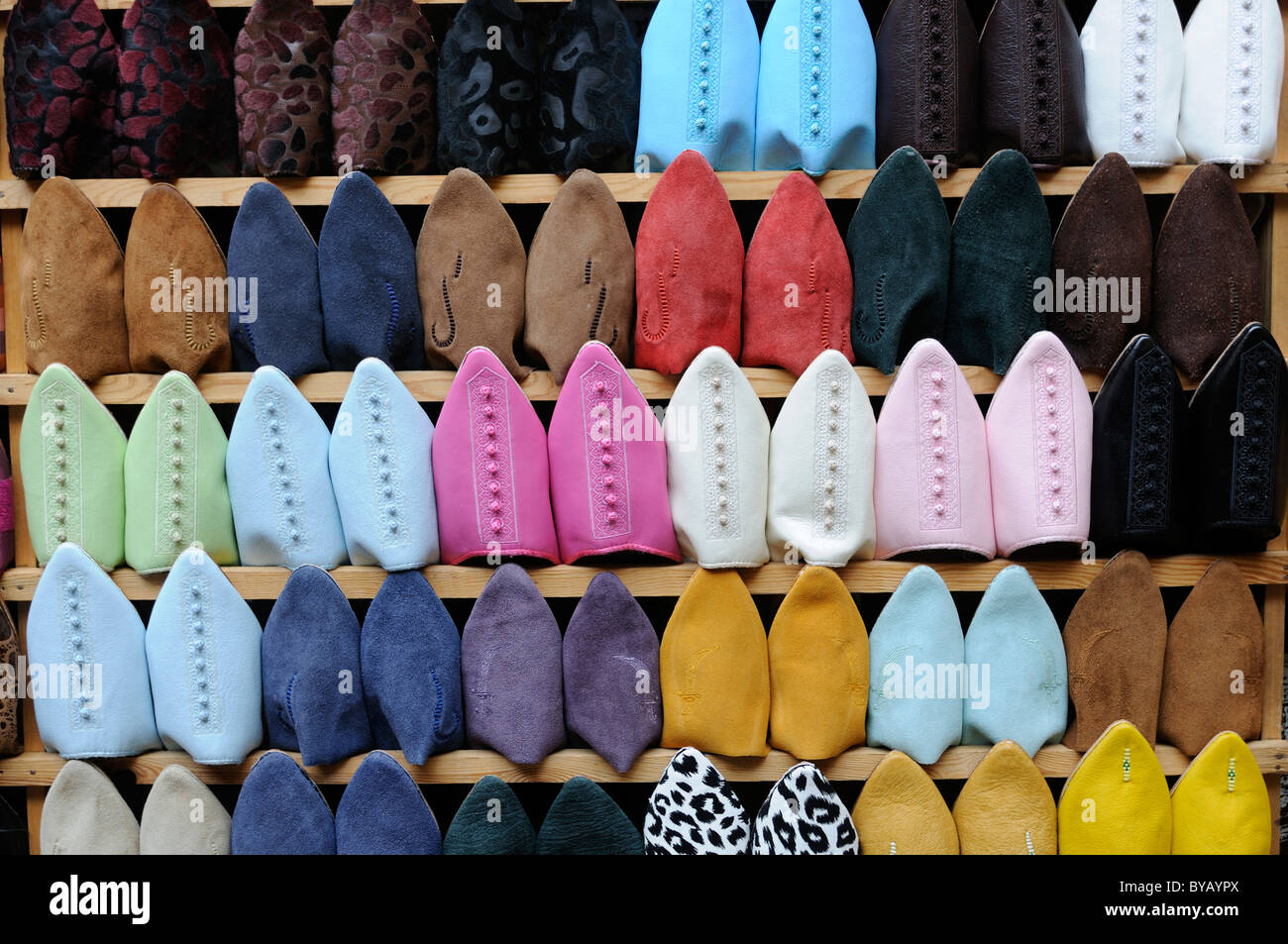 Traditional shoes for sale in a shoe rack, Fez, Morocco, Africa Stock ...