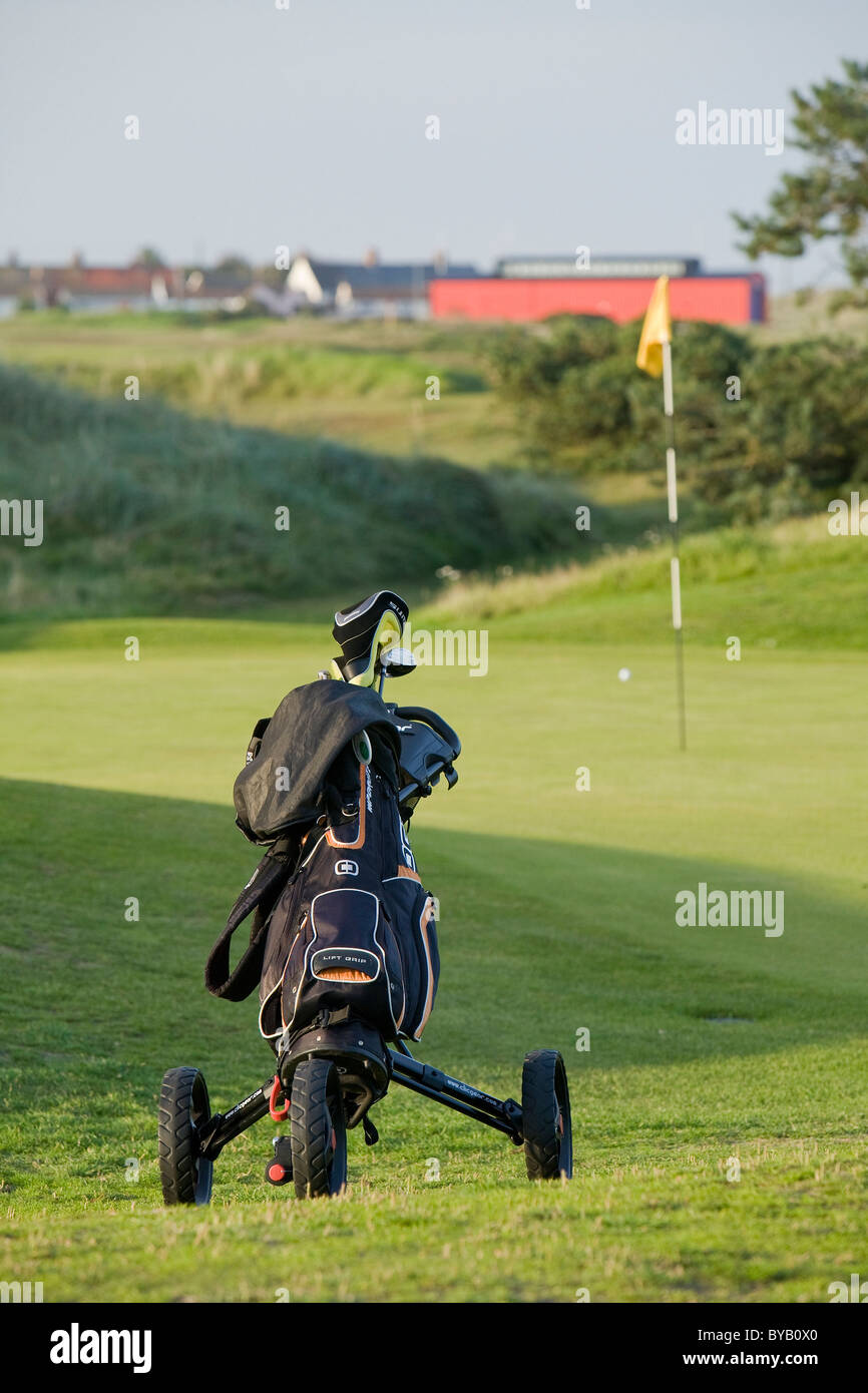 Golf caddy on Caister golf course in Norfolk Stock Photo Alamy