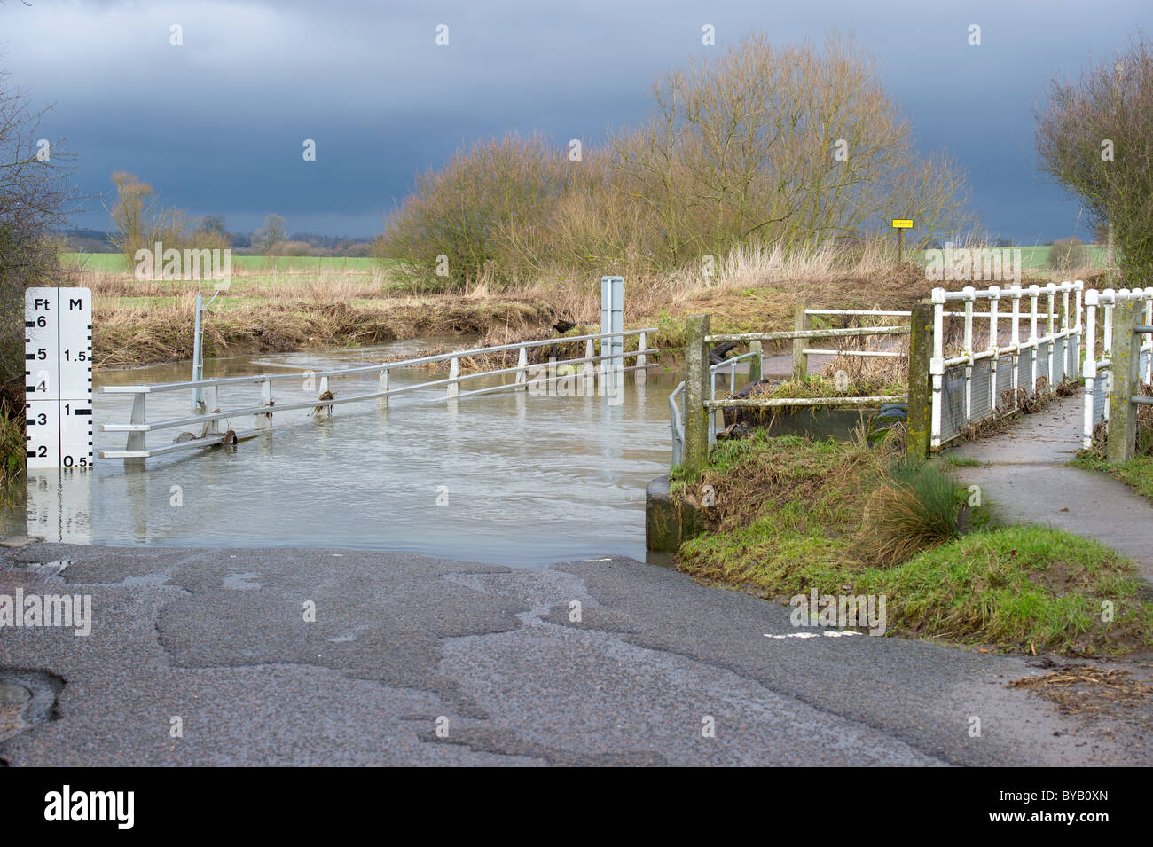 Flooded road against stormy sky in rural Essex Stock Photo - Alamy