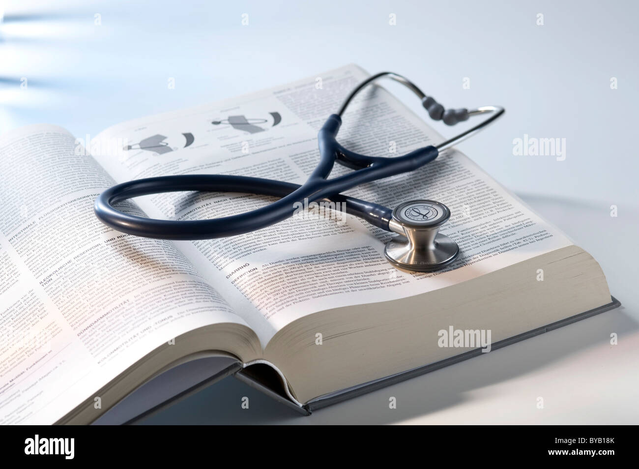 Stethoscope, medicine textbook Stock Photo Alamy