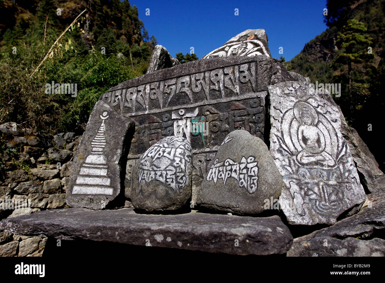 Piled up Mani stones, sacred stone tablets, Khumbu, Sagarmatha National Park, Nepal, Asia Stock Photo