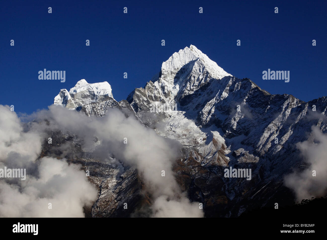 Clouds in front of Mt. Kangtega and Mt. Thamserku, Khumbu, Sagarmatha National Park, Nepal, Asia Stock Photo