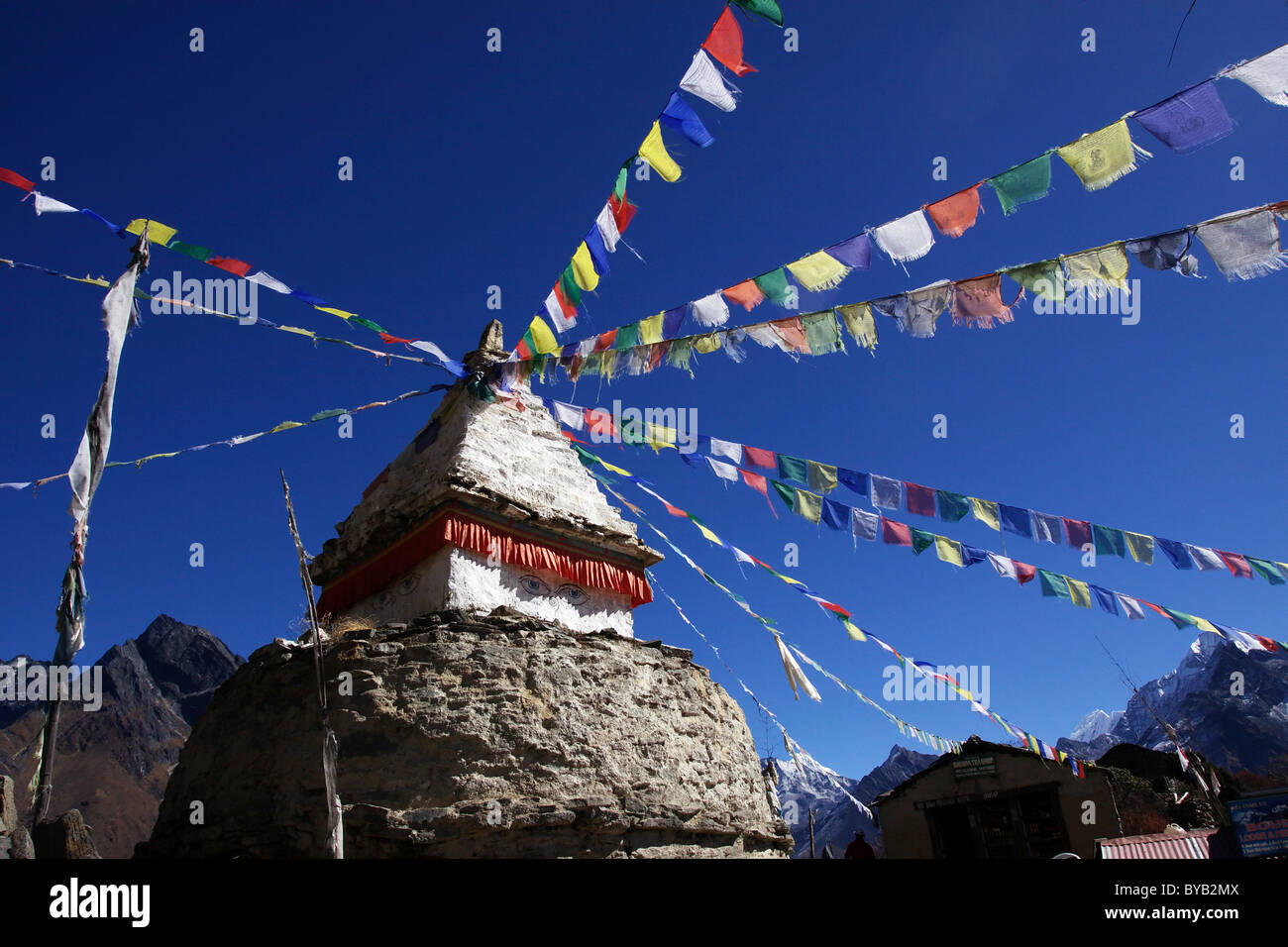 A stupa with prayer flags in Mongla, Khumbu, Sagarmatha National Park, Nepal, Asia Stock Photo