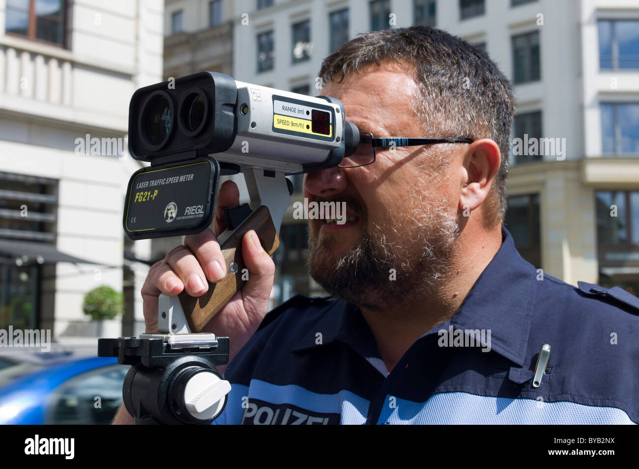 Police officer with a laser gun for speed monitoring, Berlin, Germany,  Europe Stock Photo - Alamy