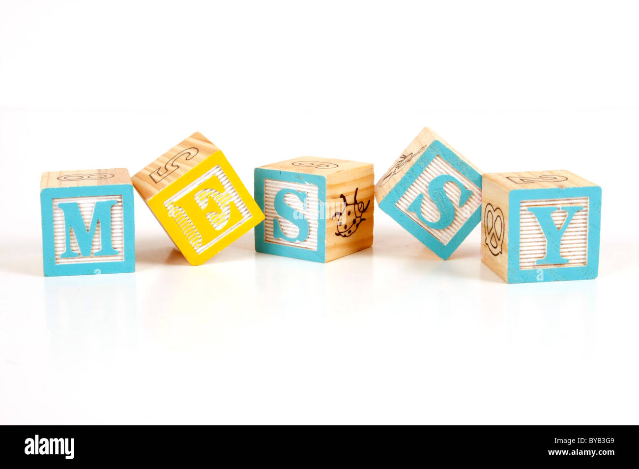 Childrens colorful blocks spell messy Stock Photo