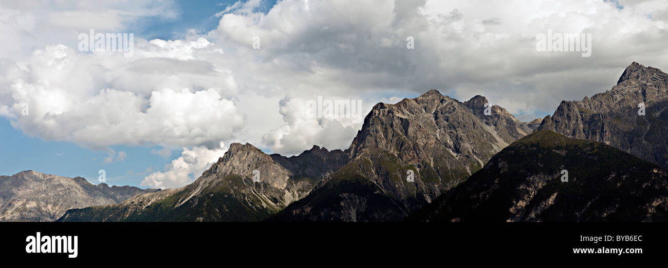 Mountain panorama with intense clouds, looking towards Mt. Piz Lischana and Piz S-chalambert, Lower Engadine, Canton Grisons Stock Photo