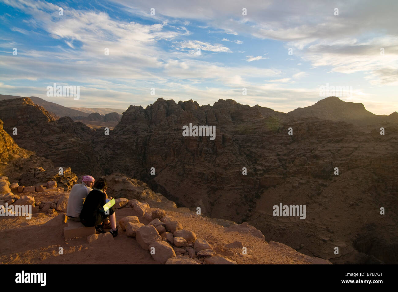 Couple overlooking the rocks near Petra in the twilight, Jordan, Middle East Stock Photo