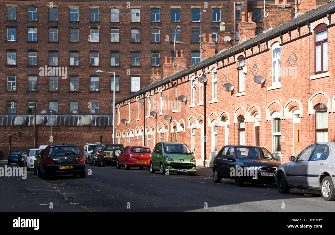 Ryecroft Mill (1837), former cotton mill, and terraced housing, Ashton under Lyne, Tameside, Greater Manchester, England, UK Stock Photo