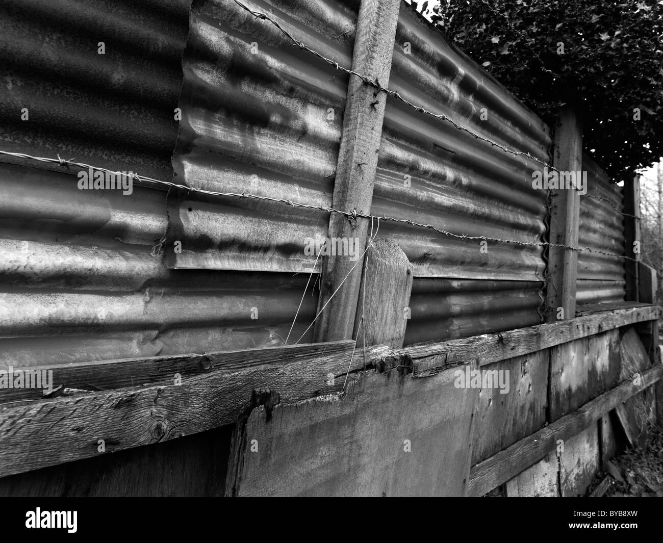 Corrugated sheeting used as a fence Stock Photo