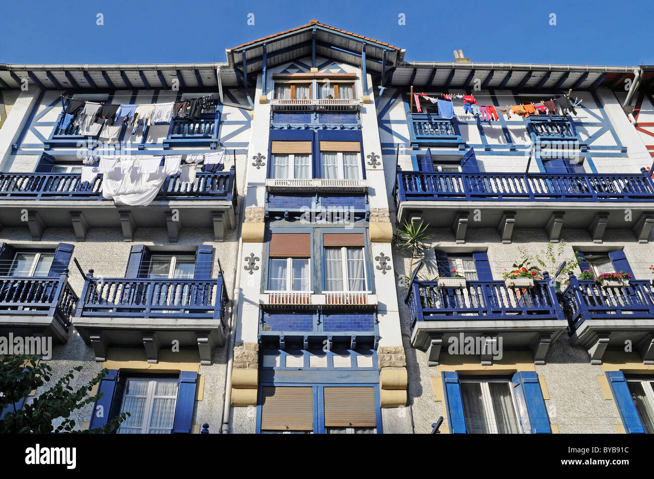 Colourful facade with blue shutters and balconies, fishing quarter, Hondarribia, coastal village, Irun, Pais Vasco Stock Photo