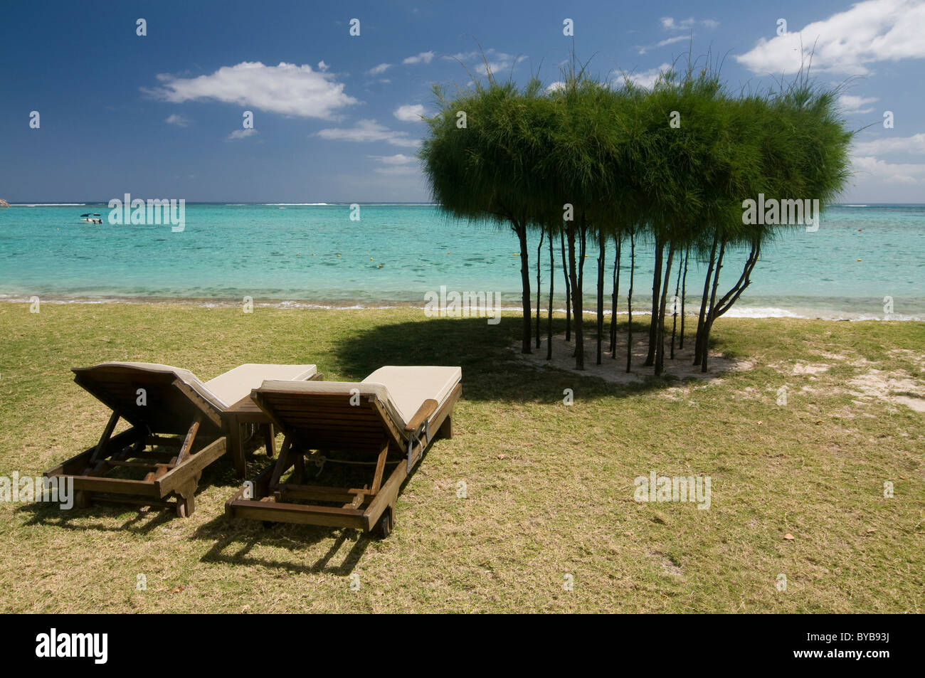 Sun loungers on the beach Dinarobin Hotel, Mauritius, Africa Stock Photo