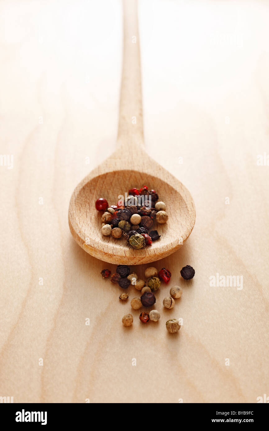 wooden spoon with peppercorns Stock Photo