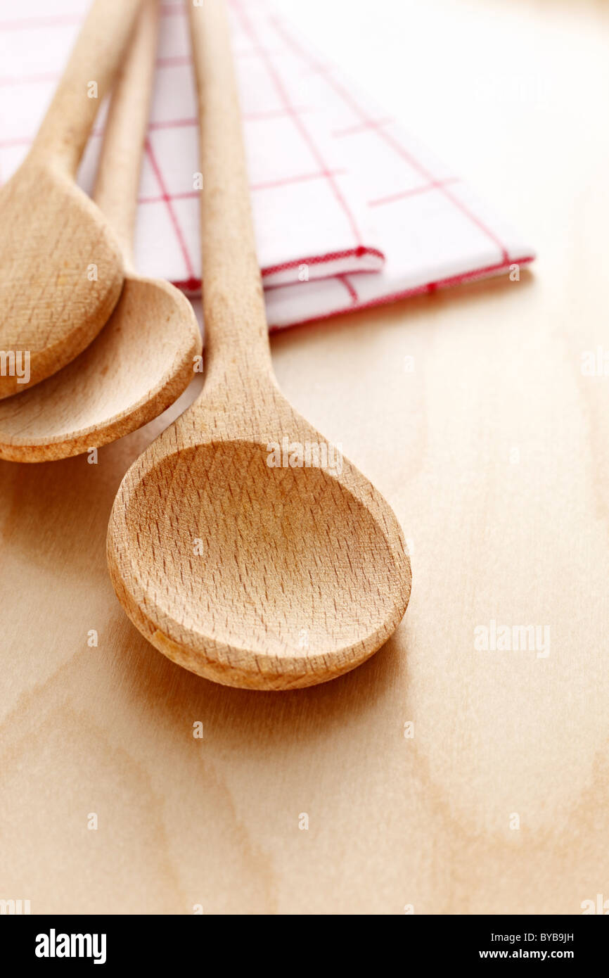 wooden spoon with tea towels Stock Photo