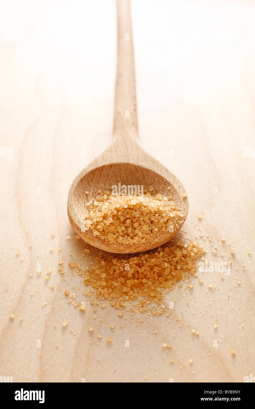 wooden spoon with brown sugar Stock Photo