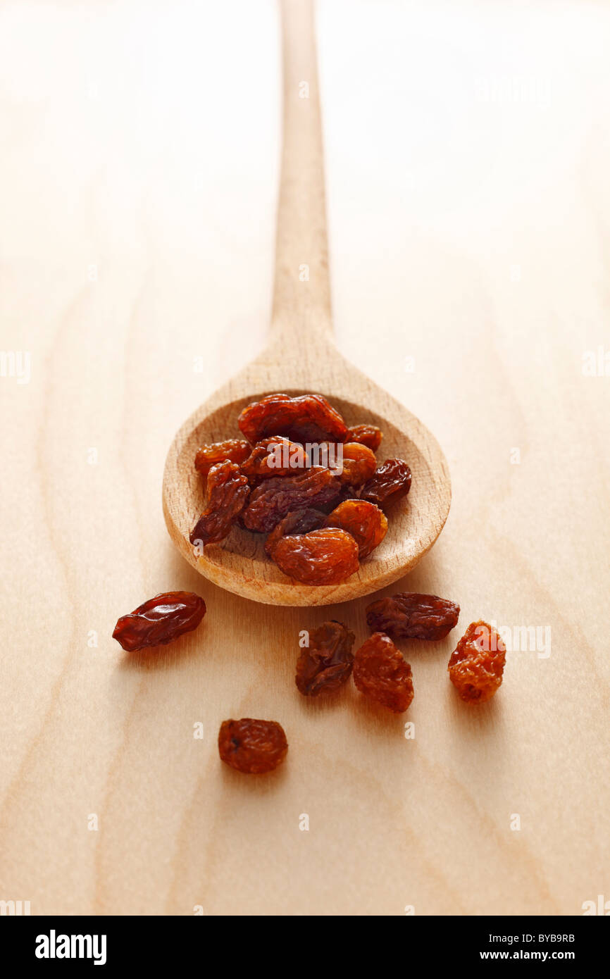wooden spoon with raisins Stock Photo
