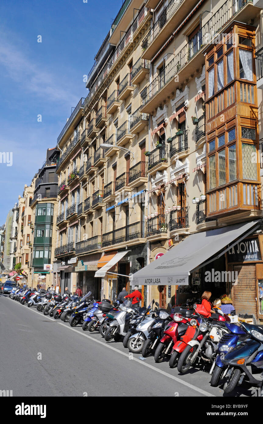 Motorcycles parked in a parking bay, building facades, old town, San Sebastian, Pais Vasco, Basque Country, Spain, Europe Stock Photo
