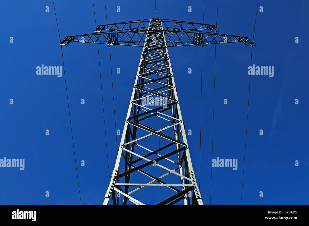 Electricity pylon against a blue sky Stock Photo - Alamy