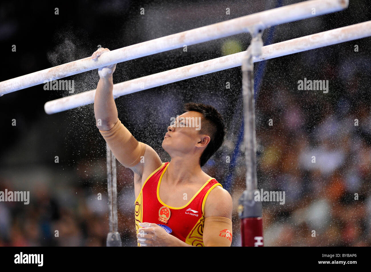 Guanyin Wang, CHN, preparing the parallel bars with magnesia, EnBW Gymnastics World Cup 2010, 28th DTB-Cup, Stuttgart Stock Photo