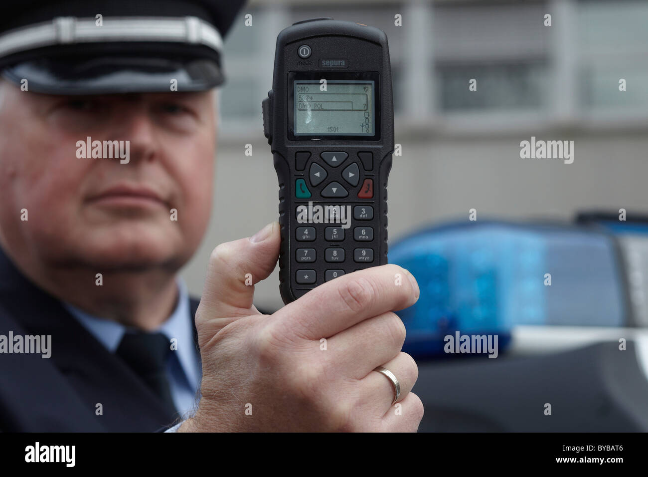 Police officer displaying a new digital radio which is currently being tested by the Rhineland-Palatinate police, Koblenz Stock Photo