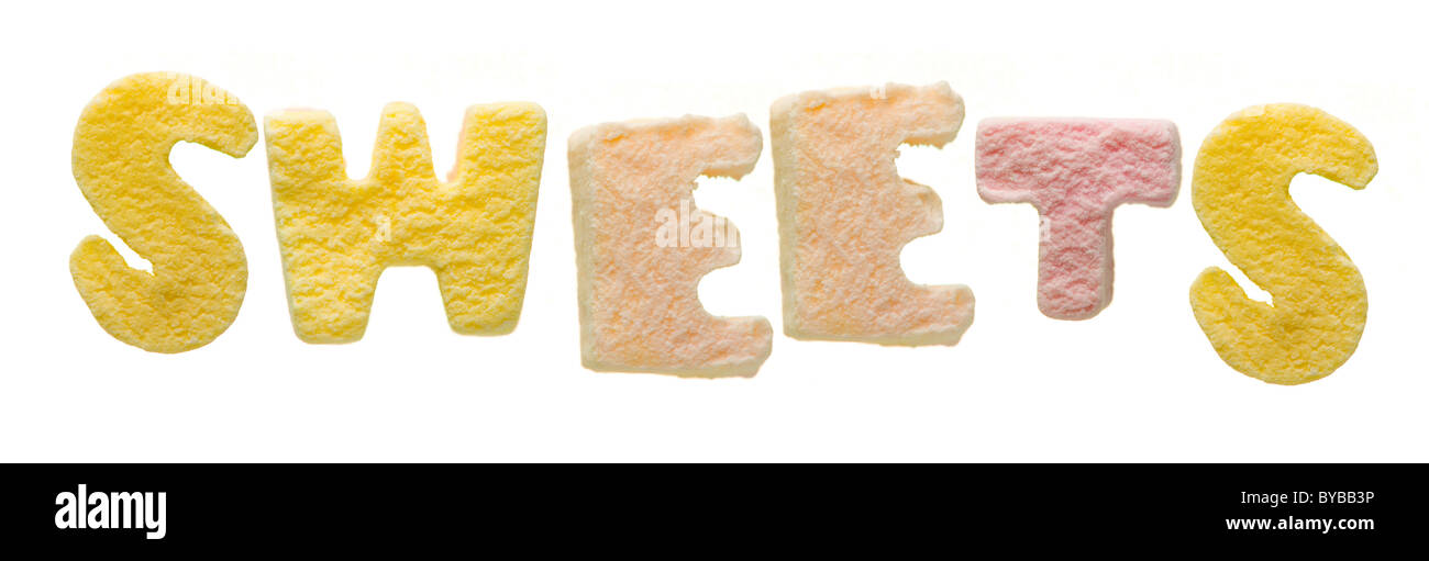 Studio shot on white background of sweet letters -spelling out the word Sweets Stock Photo