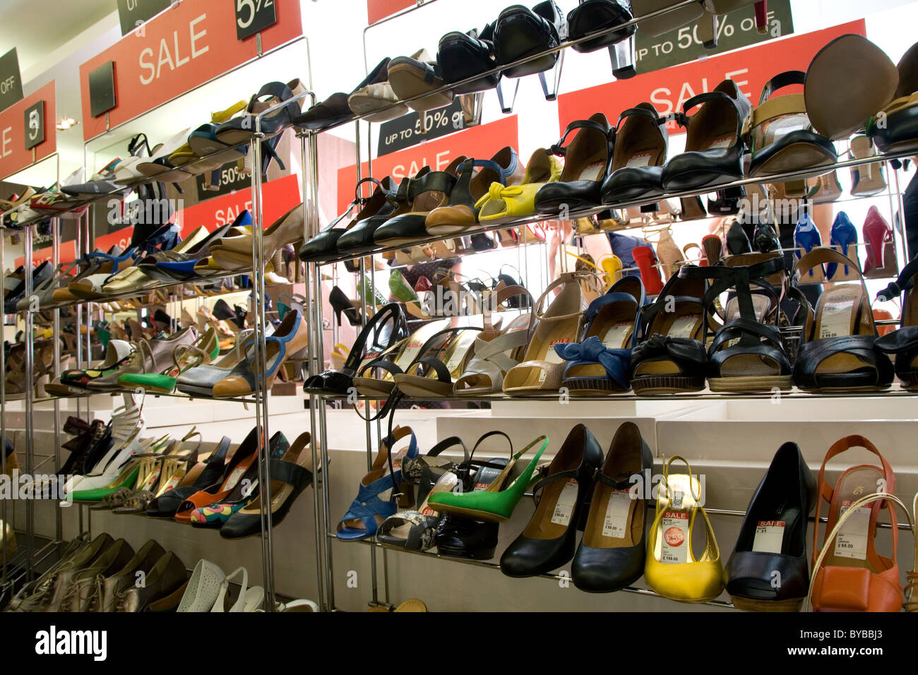 Rack of ladies shoes in a sale Stock 