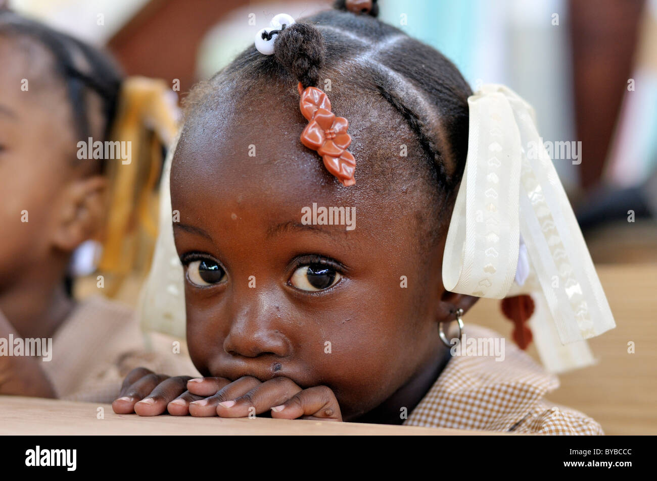 Portrait of a little girl at a school, camp for victims of the January 2010 earthquake, Croix-des-Bouquets district, , Haiti Stock Photo