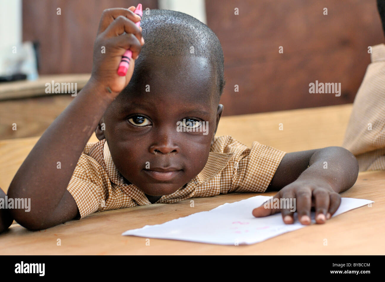 Portrait of a little boy at a school, camp for victims of the January 2010 earthquake, Croix-des-Bouquets district, , Haiti Stock Photo
