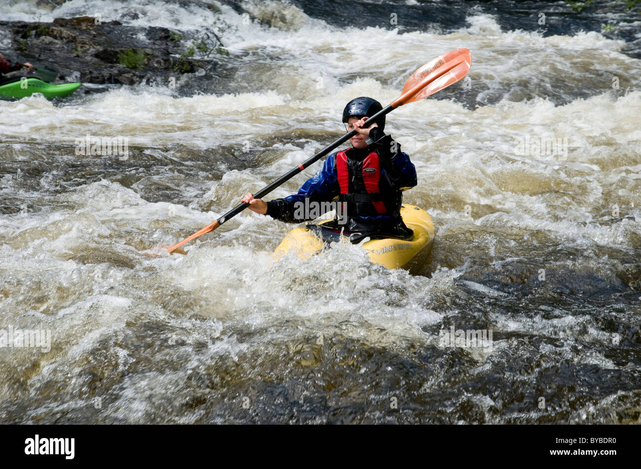 Person white water canoeing Stock Photo