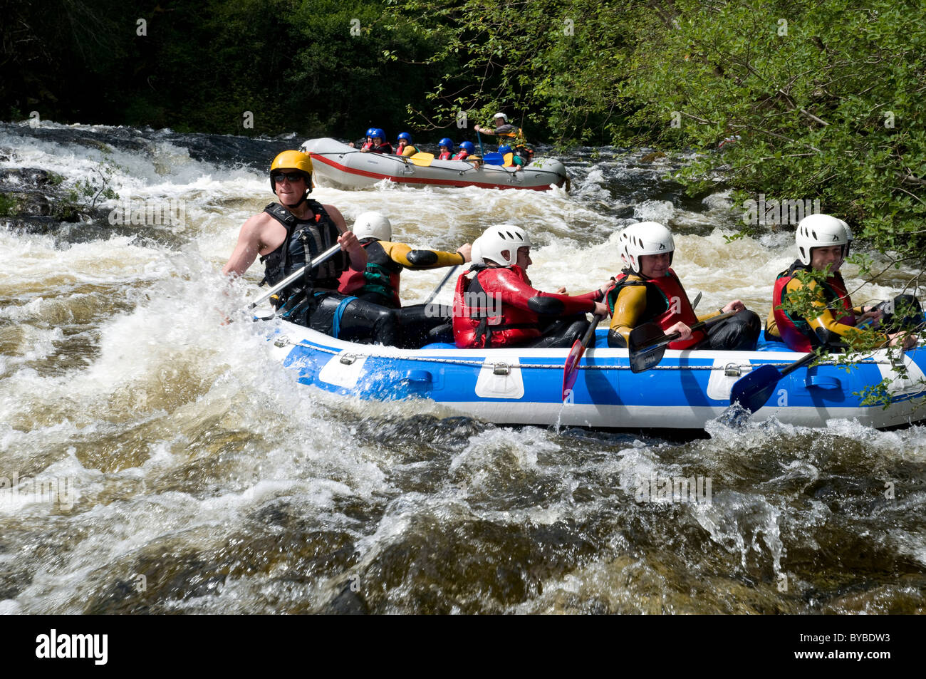 Group of people white water rafting Stock Photo