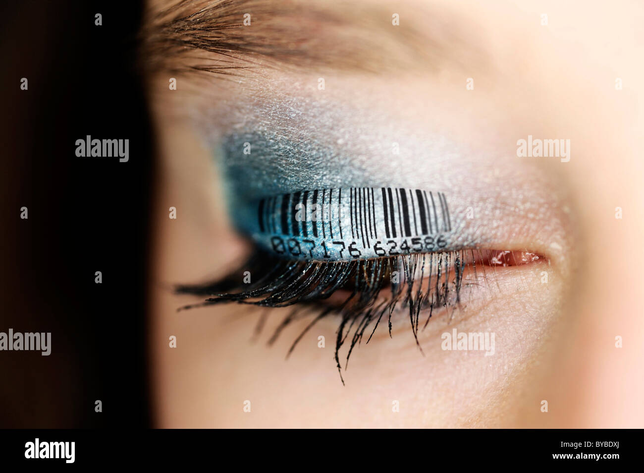Woman's eyelid with a bar code, symbolic image for population census ...