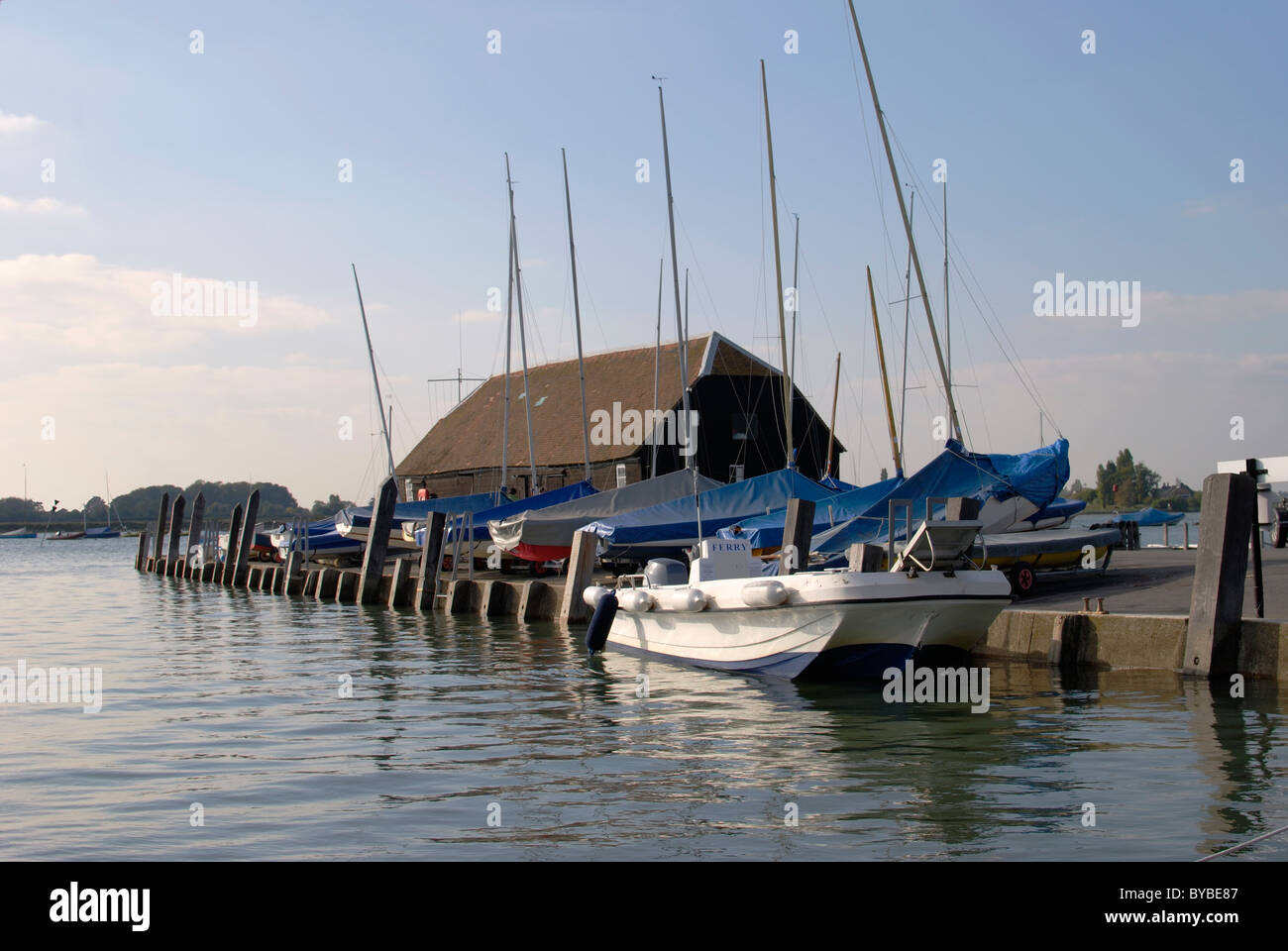 Bosham quay at high tide with ferry boat. Chichester Harbour. West