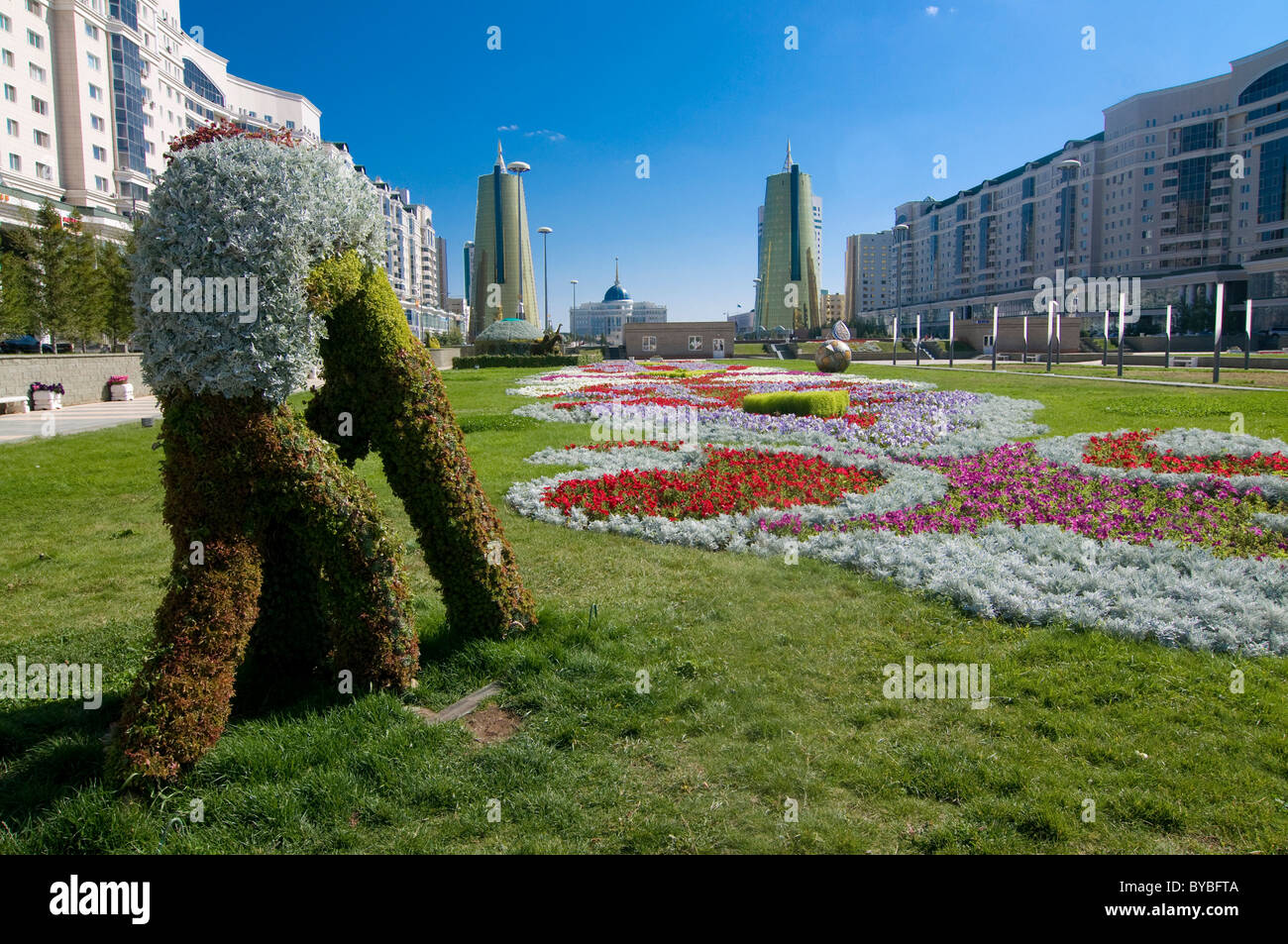 Flower beds at the Bayterek Tower, landmark of Astana, Kazakhstan, Central Asia Stock Photo