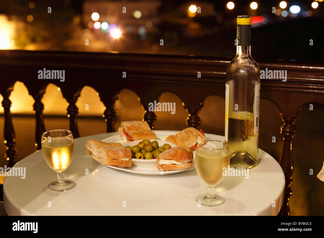 Sandwiches, olives and white wine served on a balcony, La Playa, Valle Gran Rey, La Gomera island, Canary Islands, Spain, Europe Stock Photo