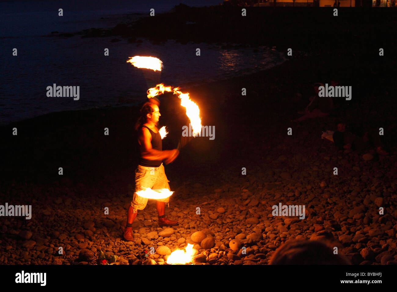 Fire dancer with torches, La Playa, Valle Gran Rey, La Gomera, Canary Islands, Spain, Europe Stock Photo
